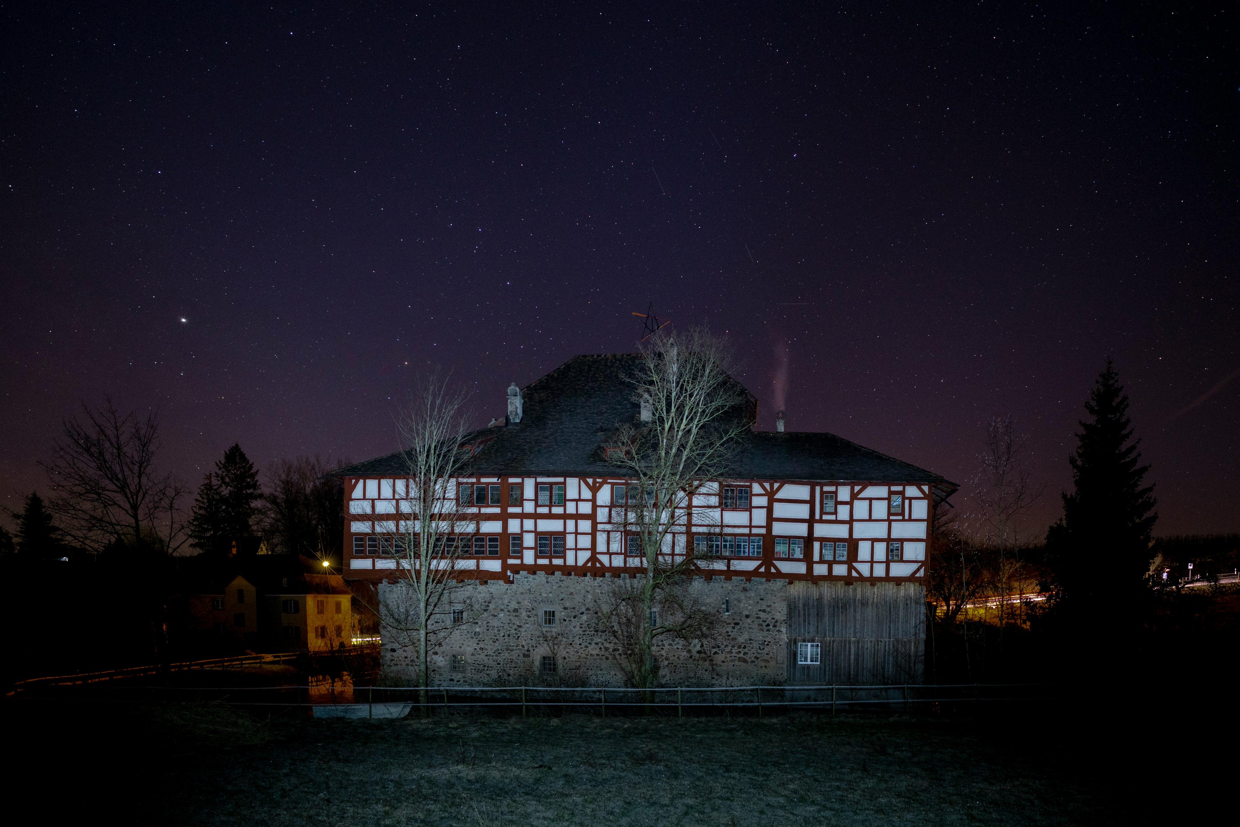 white and black house at nighttime